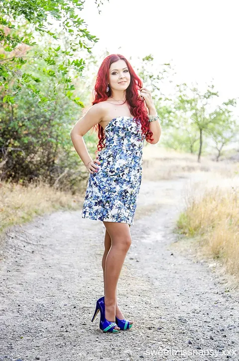 Redhead Poses in a Summer Dress and Heels Outdoors – photo 7 of 15