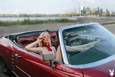 Blonde with Small Natural Tits Poses in a Car – photo 10 of 13