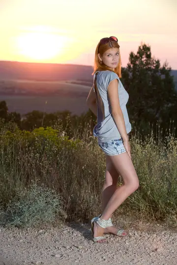 Redhead in Glasses Spreads Her Pussy on the Beach