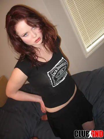Redhead in Stockings Lifts Her Top and Spreads on the Bed