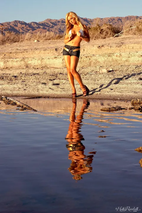 Kayden Kross: Slim Blonde Centerfold Strips and Squats Naked on the Sand – photo 3 of 17