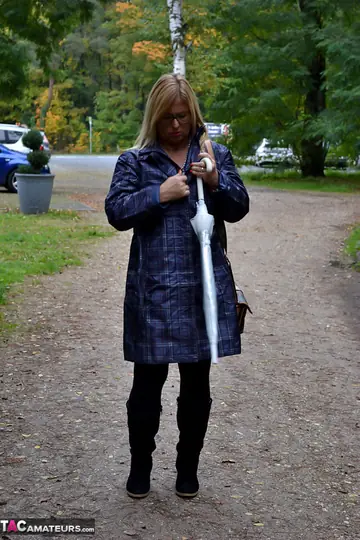 Mature Blonde MILF Shows Her Big Tits and Curves Outdoors in Rain