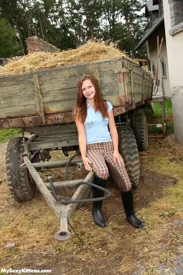 Slim Woman in Boots Toys Her Shaved Pussy by a Hay Wagon
