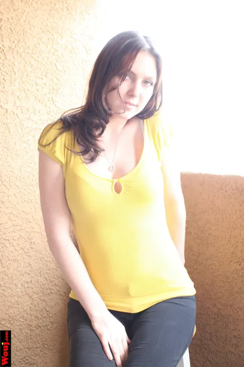 Woman Poses for the Camera in Her Clothes – photo 8 of 15