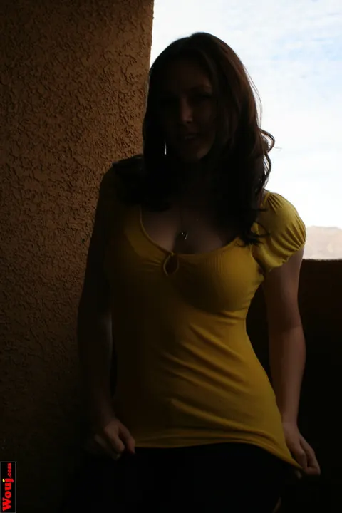 Woman Poses for the Camera in Her Clothes – photo 2 of 15