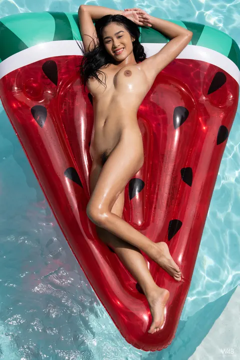 Asian Brunette Strips Off Her Bikini and Oils Her Big Tits Outdoors – photo 18 of 20