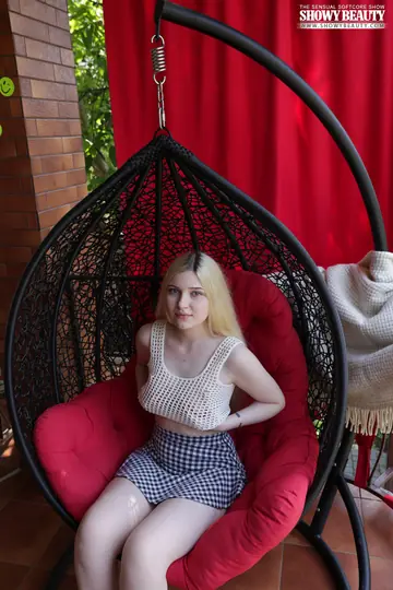 Tattooed Blonde Opens Her Legs Wide on a Chair