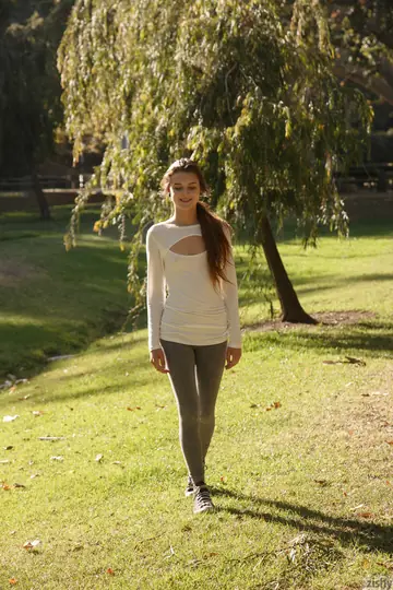 Brunette with Short Hair Strips Naked in the Park