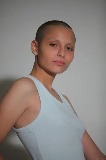 Short-Haired Brunette Undresses and Holds Her Pussy Open