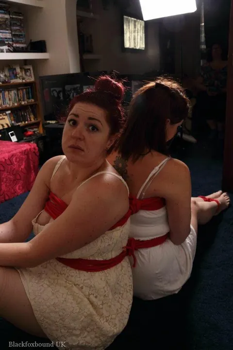 Curvy Redhead in a Skirt Gets Hogtied and Cleave-Gagged – photo 3 of 16