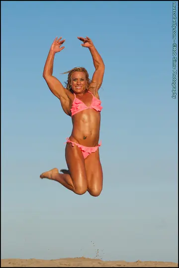 Blonde Muscle MILF Poses in a Bikini on the Beach