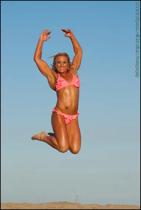 Blonde Muscle MILF Poses in a Bikini on the Beach – photo 1 of 15
