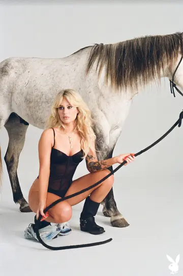 Woman Poses Nude on a Horse for a Glamour Session