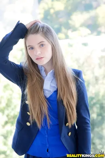 Brunette Strips Out of Her Uniform Skirt