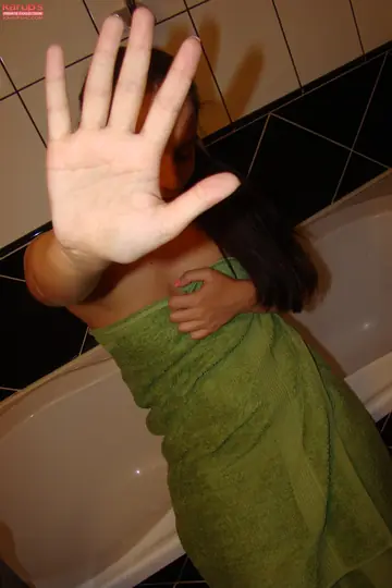 Hungarian Brunette Spreads Her Shaved Pussy in the Bathroom
