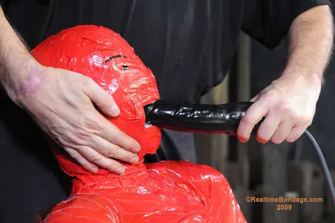 Claire Adams: Redhead MILF in Glasses Gets Wrapped Tight in Latex Mummification – photo 6 of 16