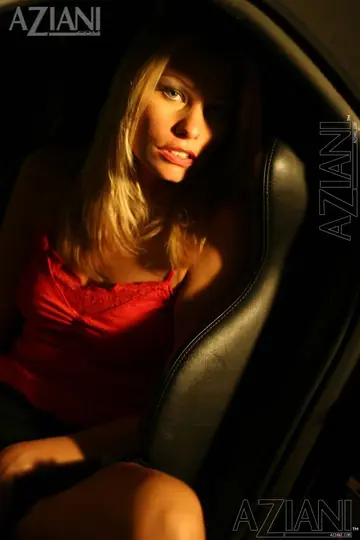 Blonde in a Skirt Spreads Her Shaved Pussy in the Car