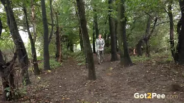 Woman Pulls Down Pants and Pees in the Forest