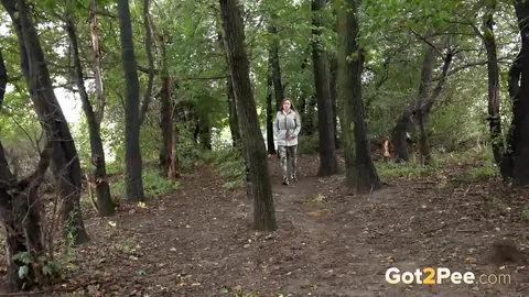 Woman Pulls Down Pants and Pees in the Forest – photo 1 of 15
