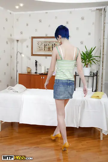 Blue-Haired Woman Strips for Oiled Massage and Fingers Herself
