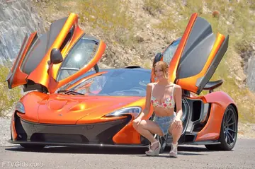 Slim Blonde with Natural Tits Masturbates by a Sports Car