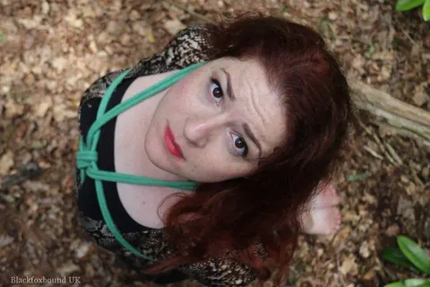 Redhead in a Skirt Hogtied in the Forest – photo 7 of 16