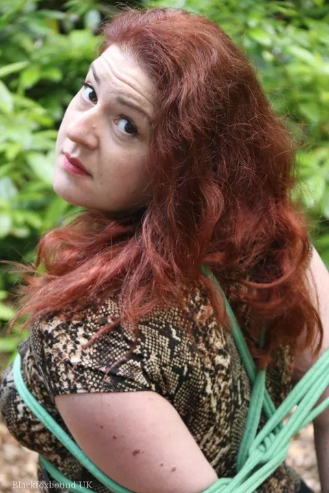 Redhead in a Skirt Hogtied in the Forest – photo 4 of 16