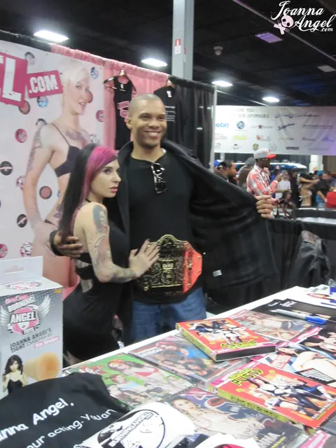 Joanna Angel: Busty Redhead and Friend Spread Their Legs at an Erotic Convention – photo 11 of 17
