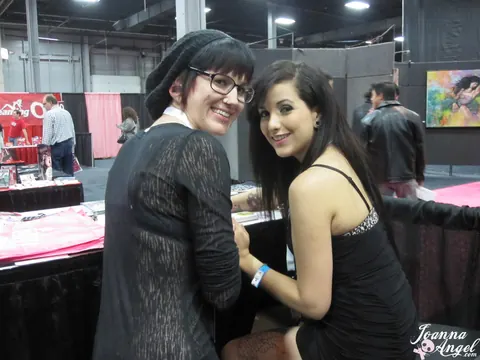 Joanna Angel: Busty Redhead and Friend Spread Their Legs at an Erotic Convention – photo 2 of 17