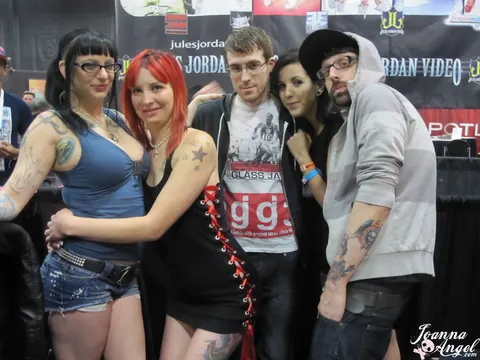 Joanna Angel: Busty Redhead and Friend Spread Their Legs at an Erotic Convention – photo 14 of 17