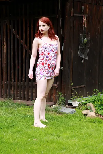 Redhead Strips Off Her Dress and Fingers Her Shaved Pussy on the Lawn