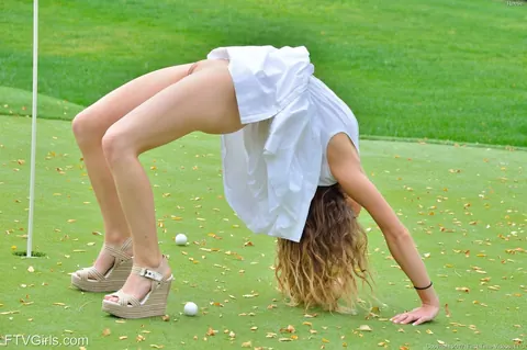 Athletic Woman Strips Outdoors and Inserts a Golf Club – photo 5 of 20
