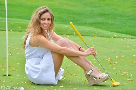 Athletic Woman Strips Outdoors and Inserts a Golf Club – photo 4 of 20