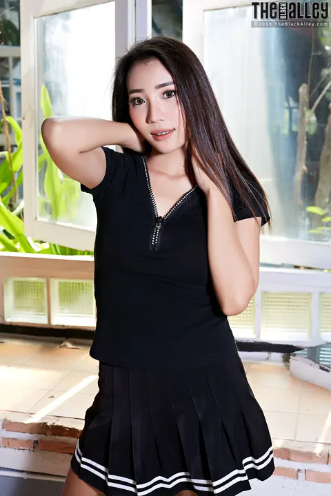 Asian Brunette with Big Tits and Piercing Shows Off in a Skirt – photo 1 of 16
