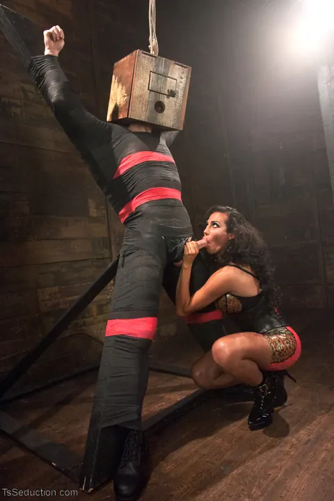 Busty Trans Woman in Latex Dominates Her Bound Man – photo 10 of 12