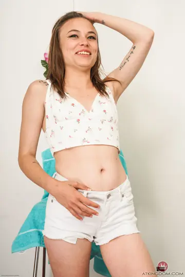 Slim Babe with Natural Tits Strips and Spreads Her Pussy