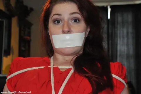 Brunette Tied Up and Gagged with Medical Tape – photo 12 of 16
