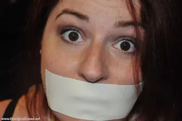 Brunette Tied Up and Gagged with Medical Tape
