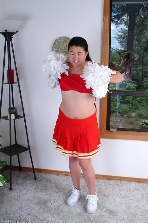 Chubby Asian Woman Sheds Her Cheer Uniform to Spread Her Hairy Pussy – photo 2 of 16