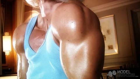 Brigita Brezovac: Blonde MILF Flexes Her Muscles and Squeezes Her Boobs in the Gym – photo 6 of 21