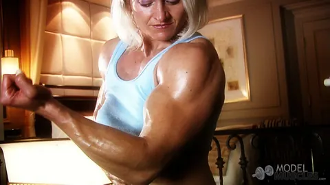Brigita Brezovac: Blonde MILF Flexes Her Muscles and Squeezes Her Boobs in the Gym – photo 7 of 21