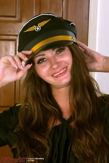 Thick Brunette MILF Strips Out of Her Pilot Uniform and Spreads Her Pussy
