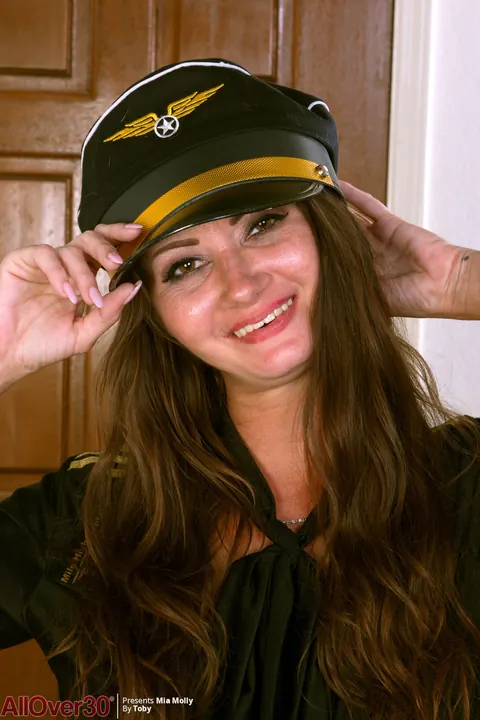 Mia Molly: Thick Brunette MILF Strips Out of Her Pilot Uniform and Spreads Her Pussy – photo 1 of 16