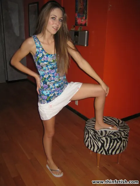 Autumn Winters: Slim Brunette Strips Off Her Panties and Spreads on Footstool – photo 4 of 16