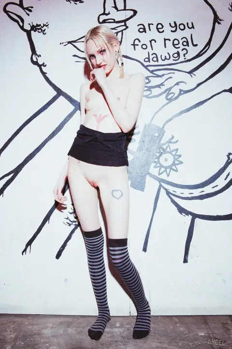 Lacey Lust: Busty Blonde Fingers Her Shaved Pussy by a Graffiti Wall – photo 13 of 17
