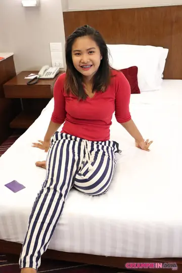 Asian Brunette Poses in Lingerie at a Hotel