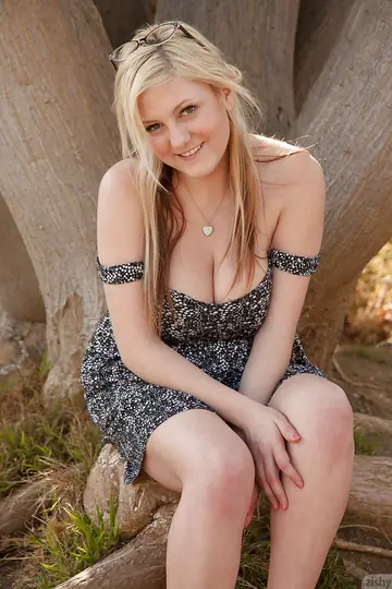 Chubby Blonde Lifts Her Skirt to Show Her Big Tits Outdoors