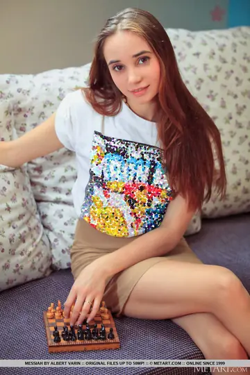 Redhead Strips Out of Her Panties and Spreads at the Chessboard