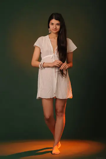 Woman Undresses and Poses Front and Back for the Camera