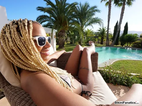 Blonde African Woman Strips Off Her Bikini on Patio in Glasses – photo 9 of 12
